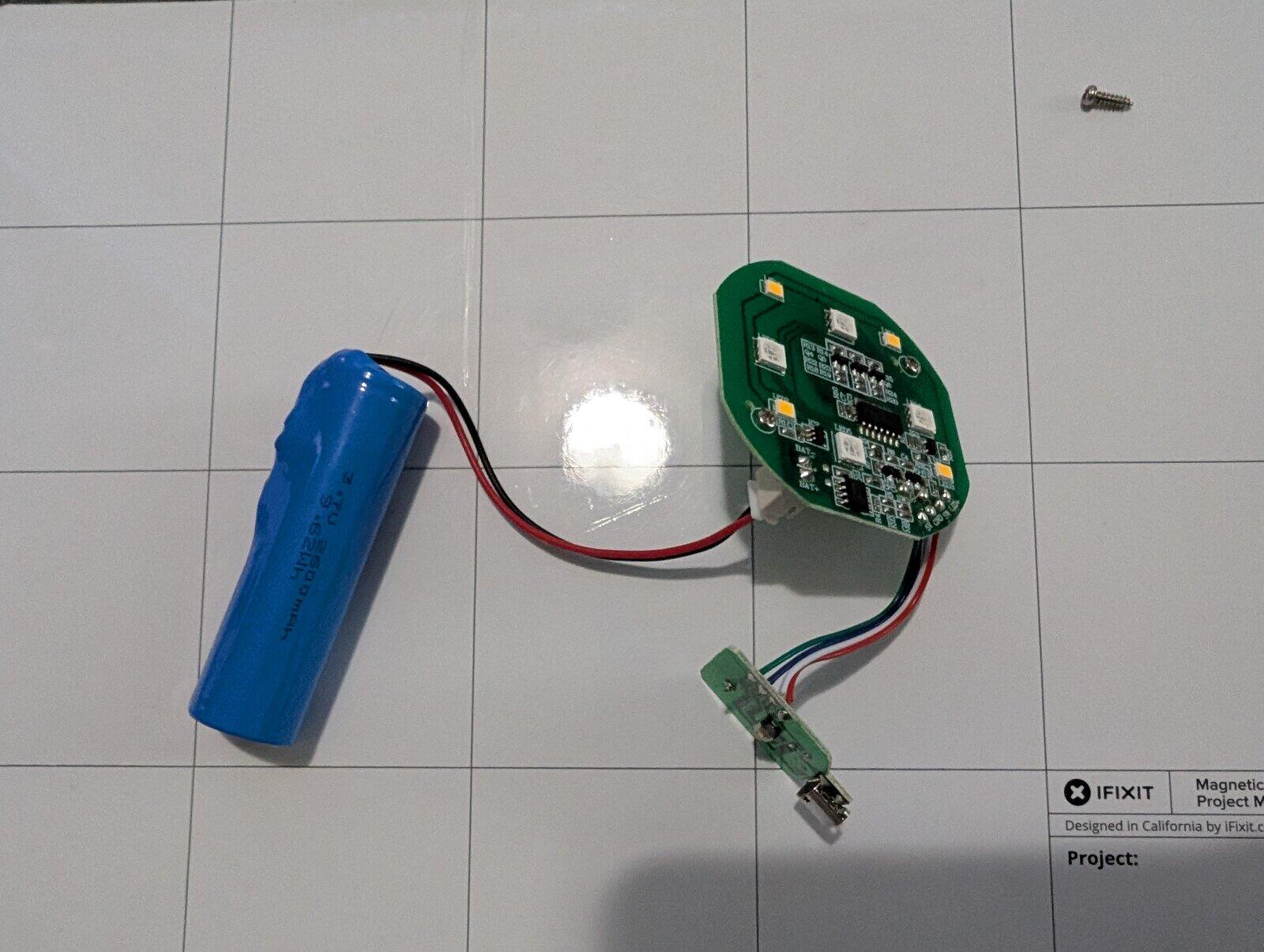 base disassembled showing the battery connected